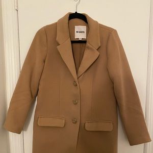 Tan trench coat. Super warm and comfortable! Perfect for the city.
